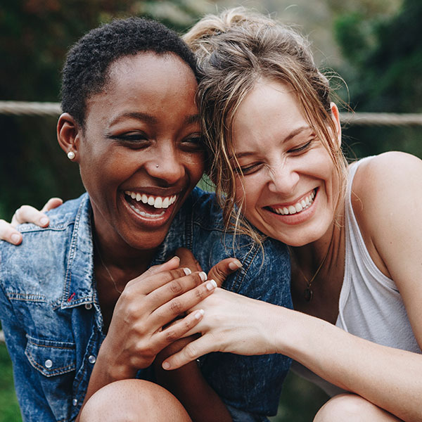 Special Offers Two Woman Laughing Outdoors